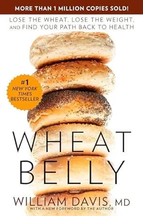 Wheat Belly book cover by William Davis MD showing stacked sliced bread with text about losing wheat and weight
