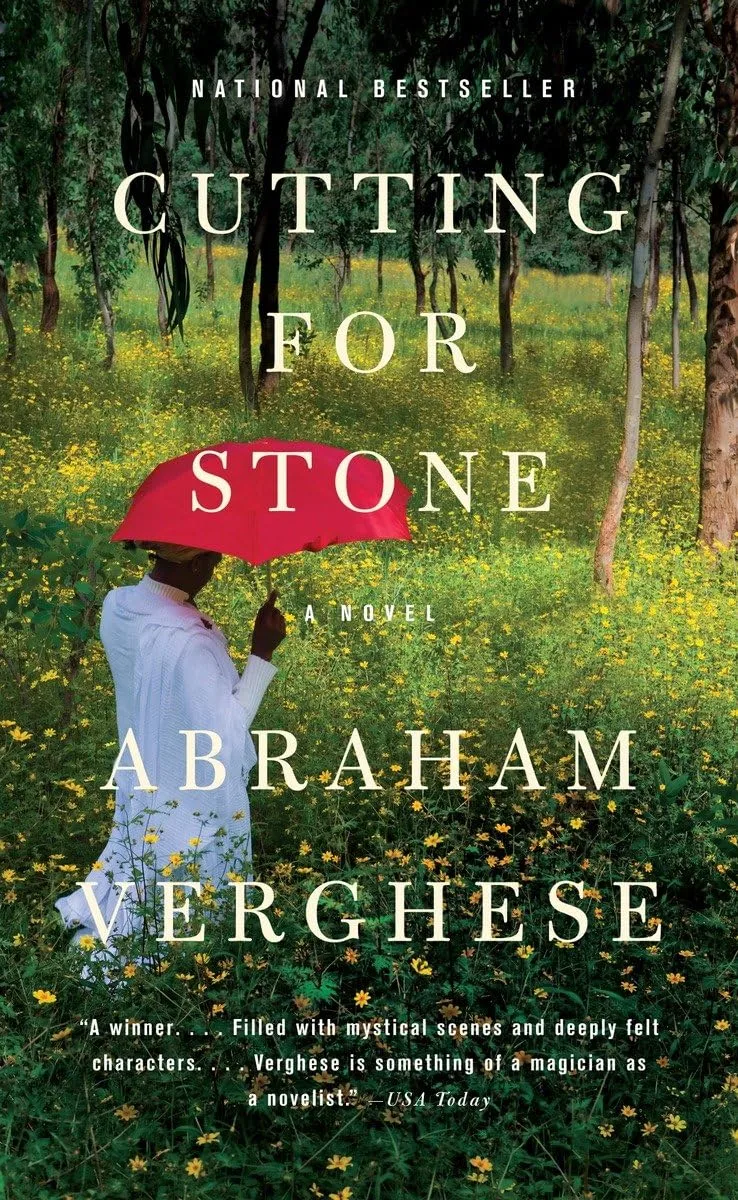 Cutting for Stone novel by Abraham Verghese showing person with red umbrella in yellow flower field