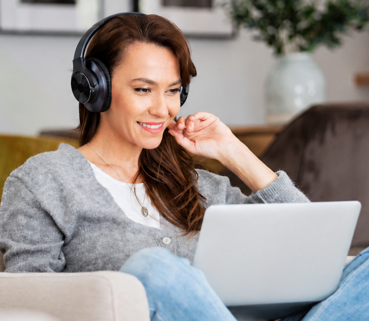 Patient attending a virtual psychiatry appointment on a laptop with a headset