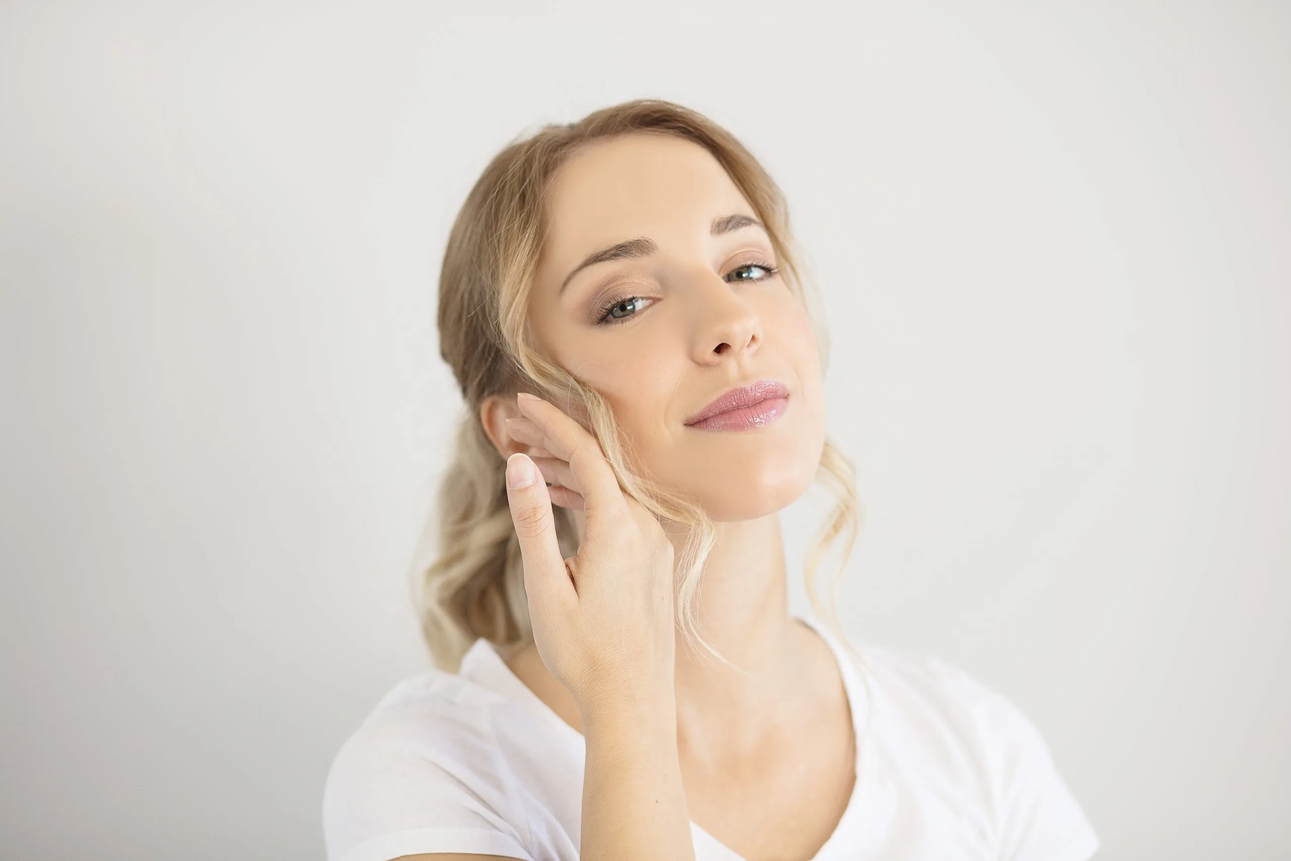 Woman with smooth, radiant skin illustrating microneedling with exosomes in Goodyear, AZ