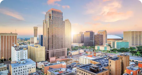 Downtown San Antonio skyline at sunset with modern and historic buildings