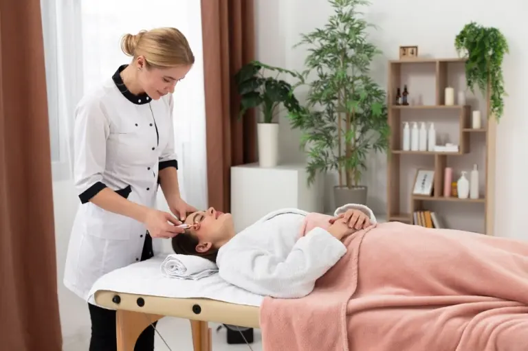 Practitioner performing a facial treatment on a patient at La Réserve Aesthetics