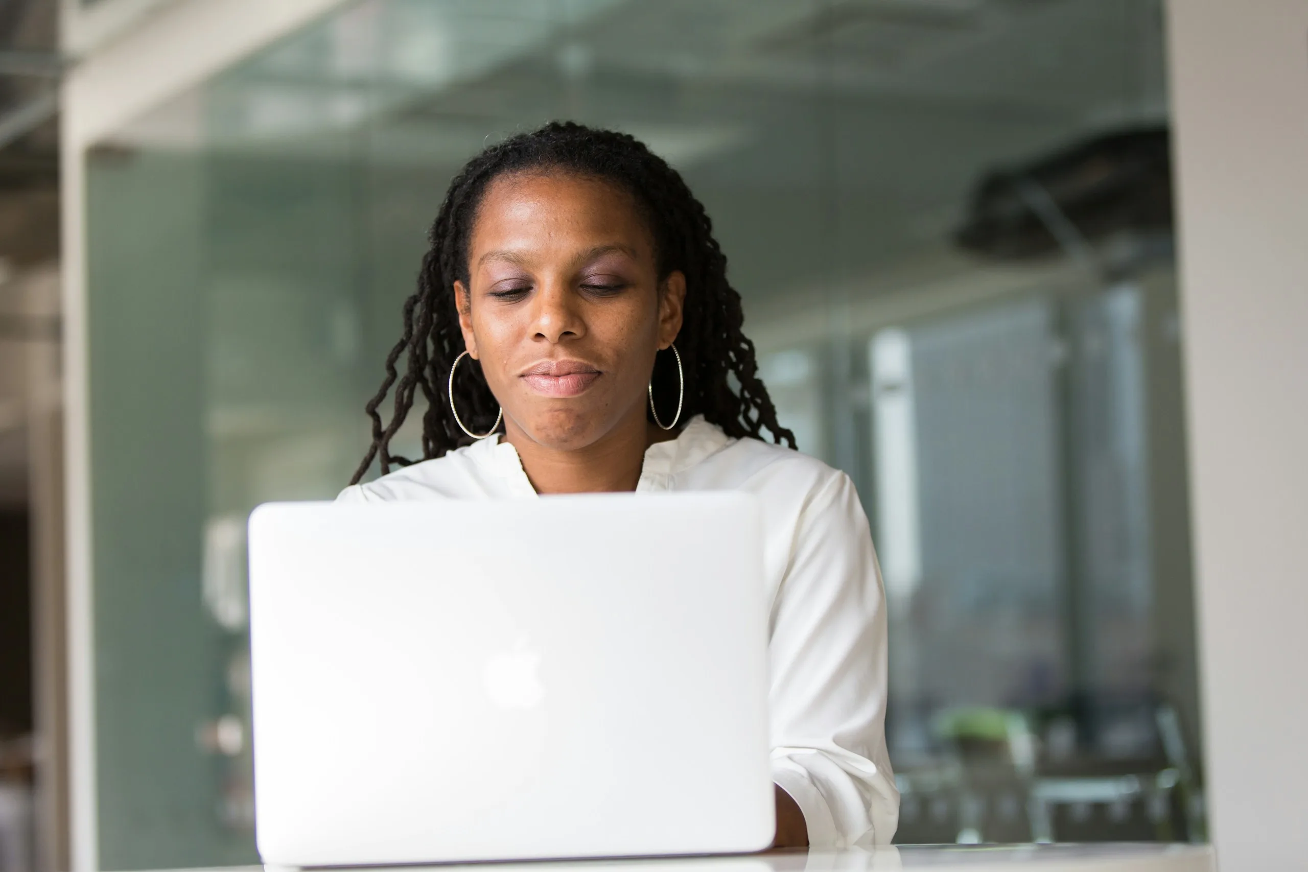 Woman focused on her laptop