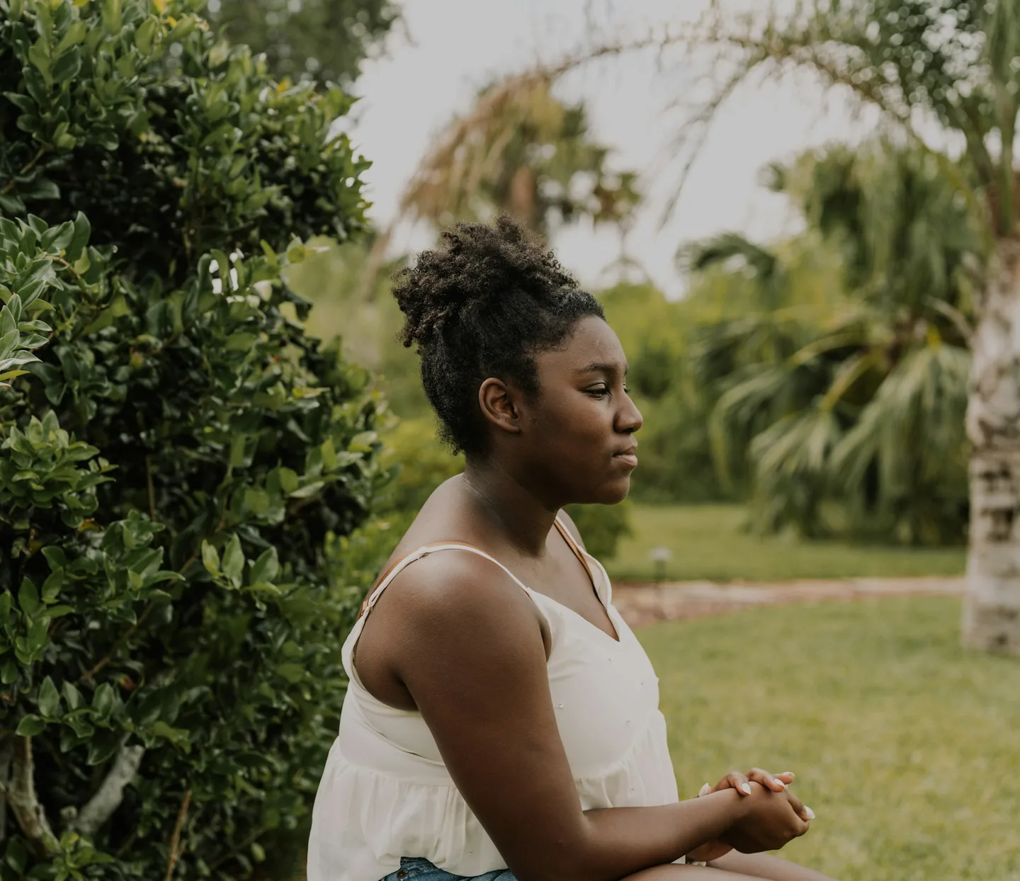 Woman sitting peacefully in a park