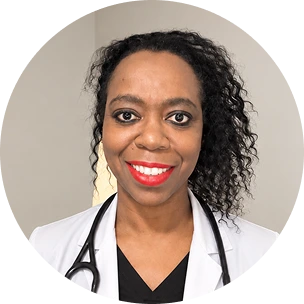 Nerisa Bryan, psychiatrist, wearing a white coat with a stethoscope