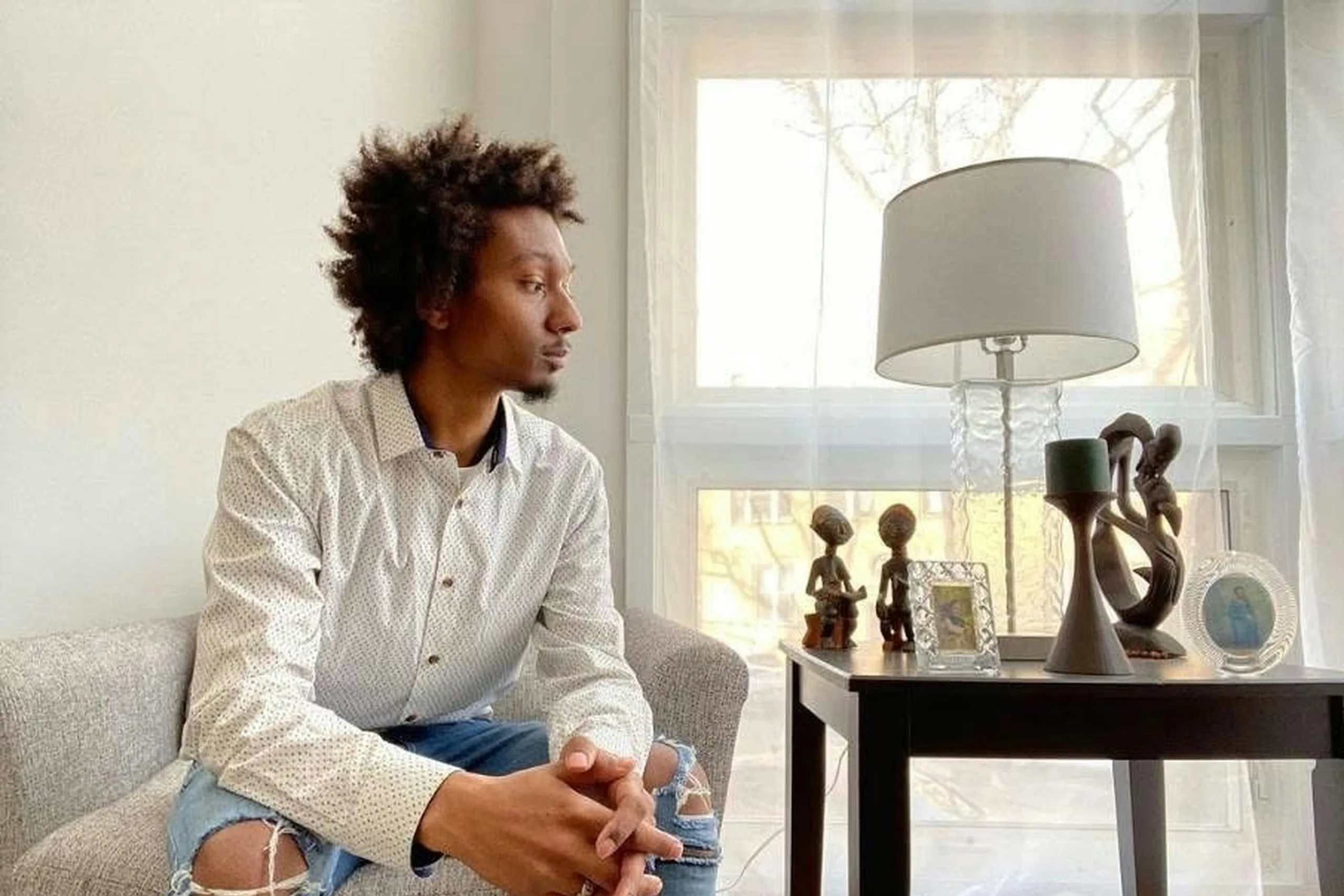 Man sitting thoughtfully at home