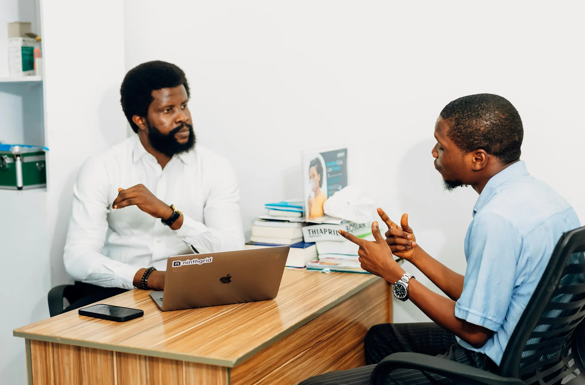 Provider talking with a patient across a desk