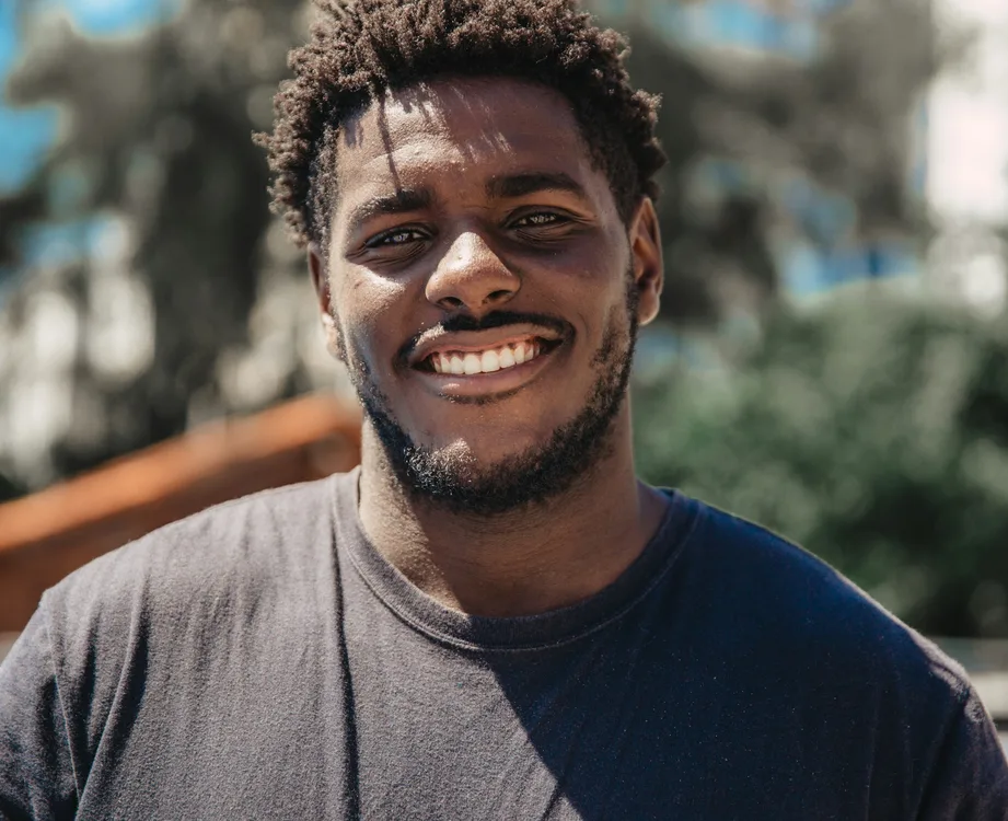 Young man smiling outdoors