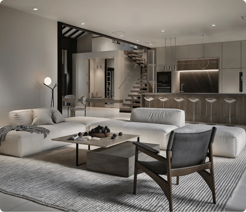 Modern open-plan living room with white sectional sofa, wooden chair, and kitchen with island seating in background