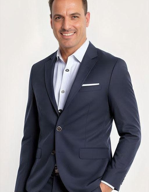 Selcuk Ipek, man in dark blazer and light blue shirt, smiling at camera