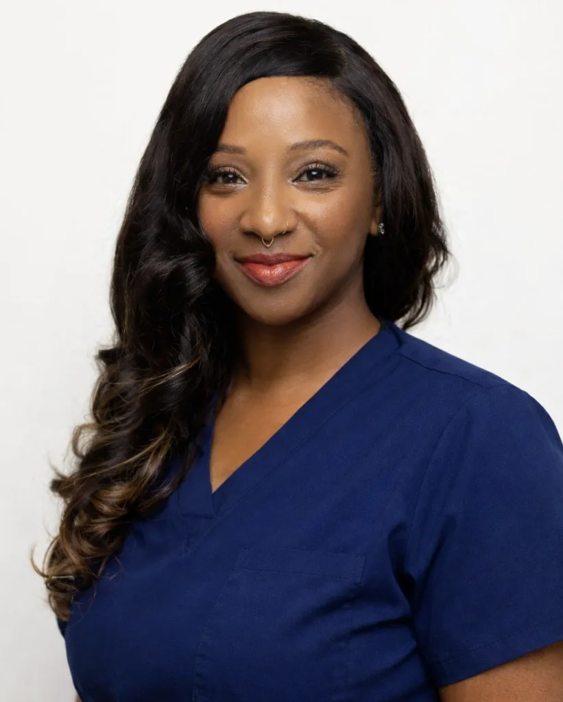 Takiysha McLeod-Ballard, healthcare professional in navy scrubs