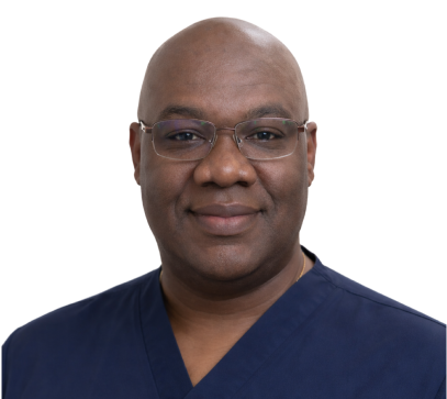 Jean Cetoute, dental professional in dark blue scrubs, headshot portrait