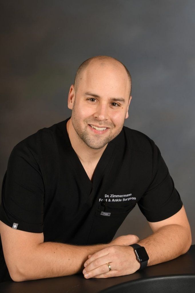 Dr. Zimmermann, foot and ankle surgeon, in black scrubs