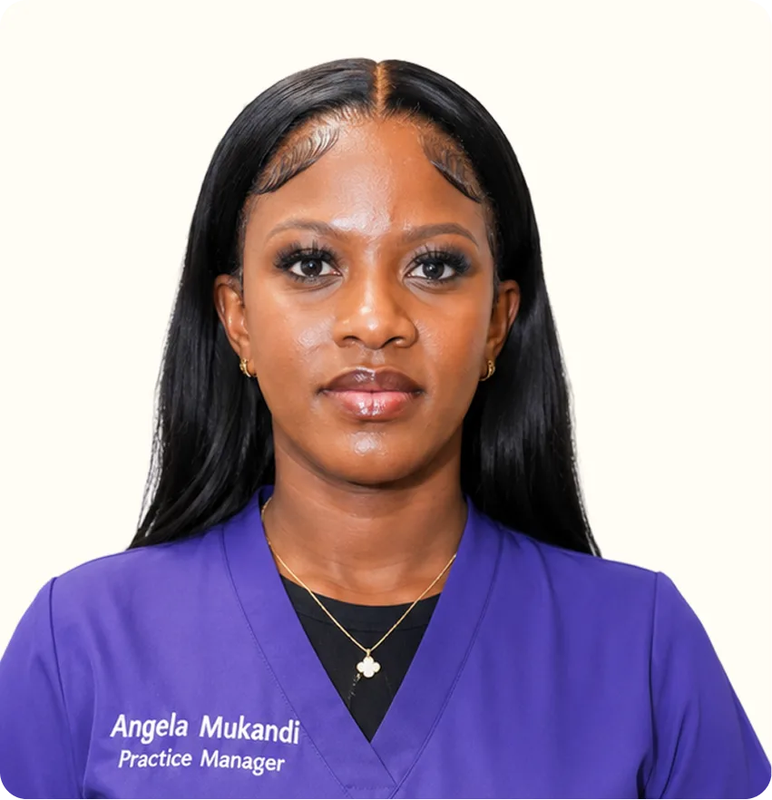 Angela Mukandi, Practice Manager, wearing purple scrubs