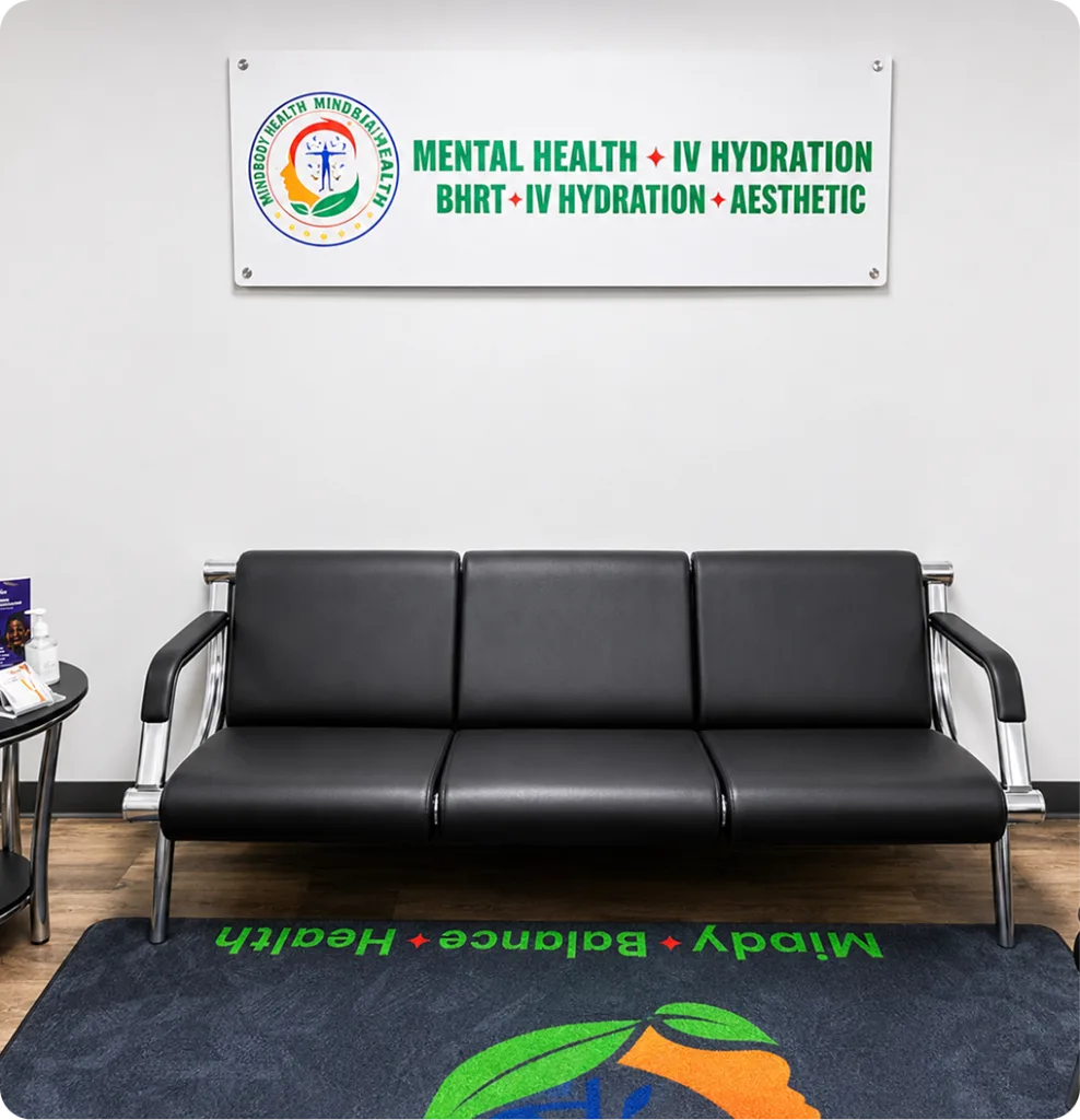 Practice waiting room with black seating, signage reading Mental Health + IV Hydration, BHRT + IV Hydration + Aesthetic