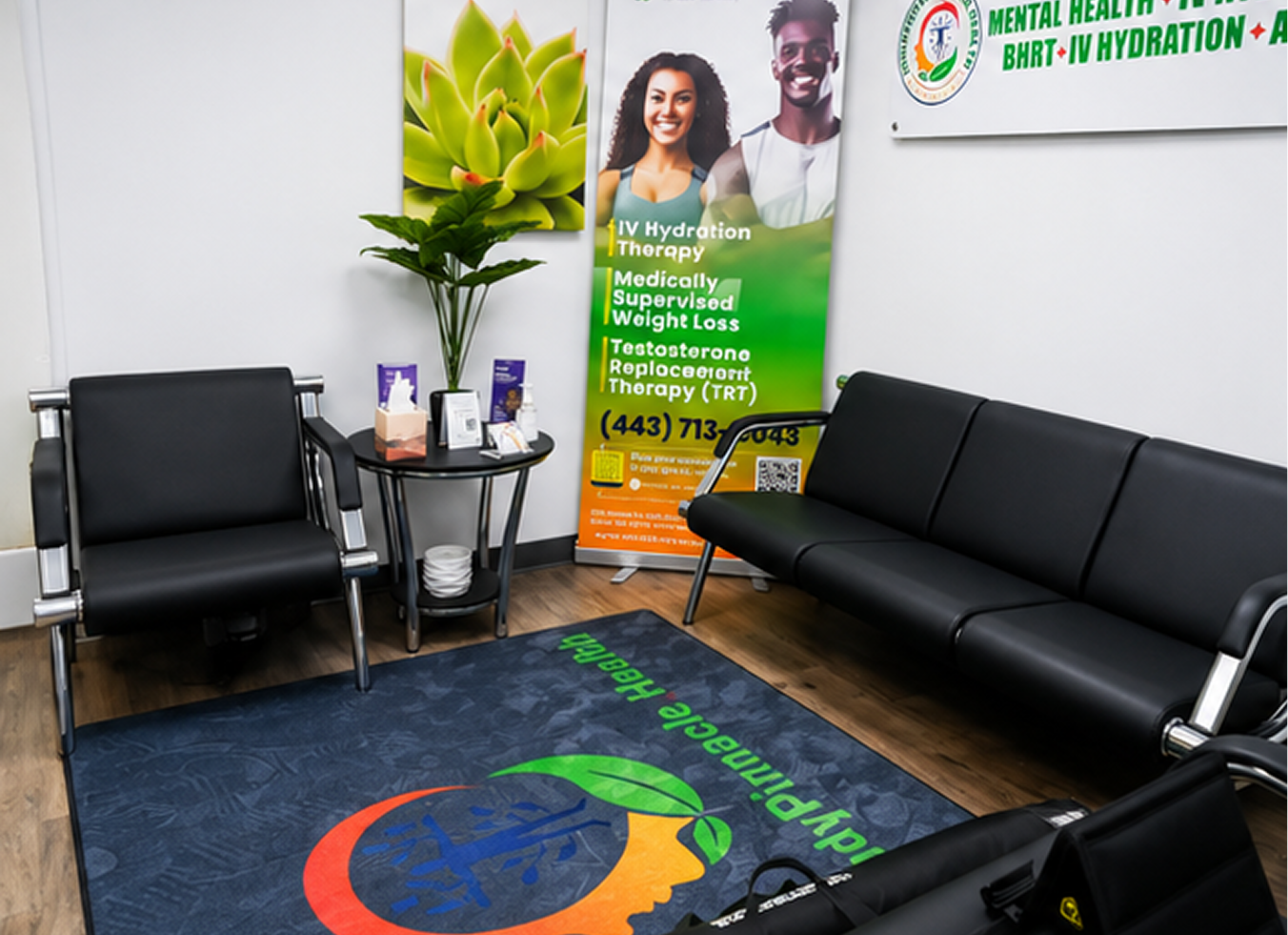 Waiting room with black leather seating, plant, treatment service poster, and branded floor mat