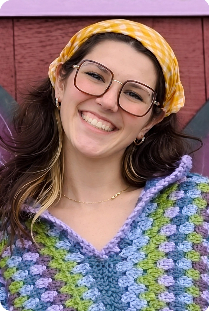 Aleksy Golemo, woman wearing glasses and yellow headband smiling
