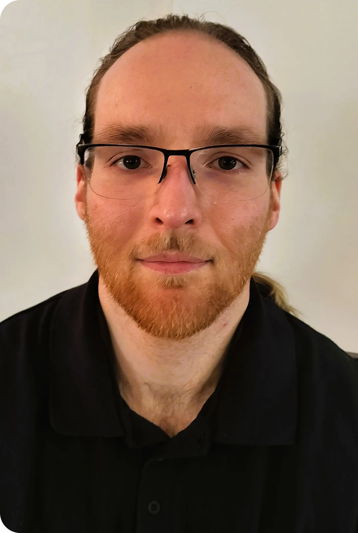 Christian Foley, man wearing glasses and black shirt