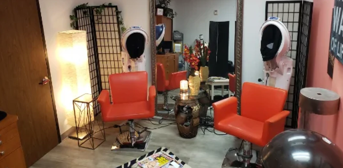 MyScalpFit salon treatment area with red chairs, mirrors, and styling stations