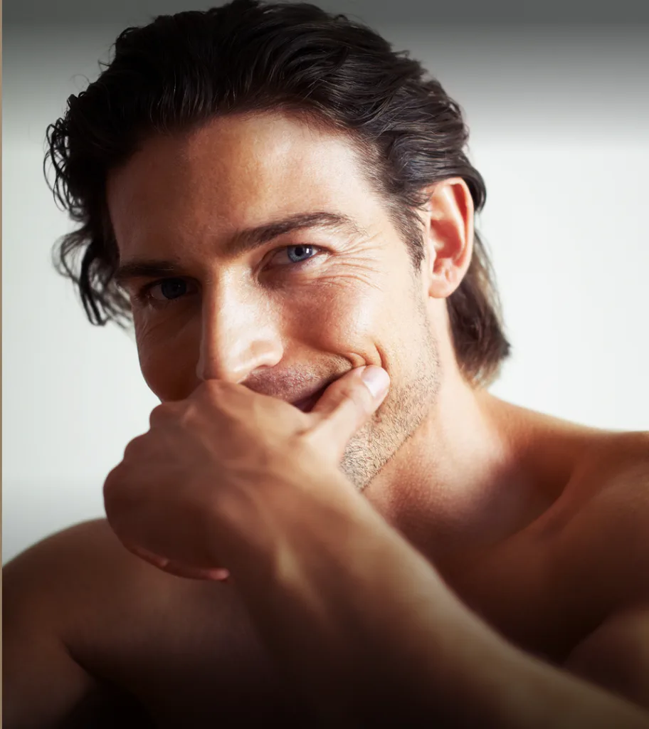 Man with hand near face showing facial features and skin texture