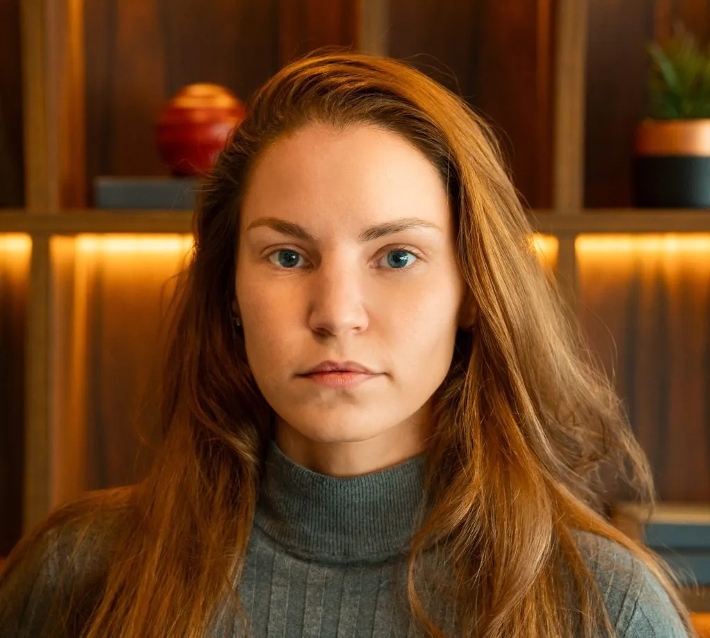 Woman in a green sweater at home