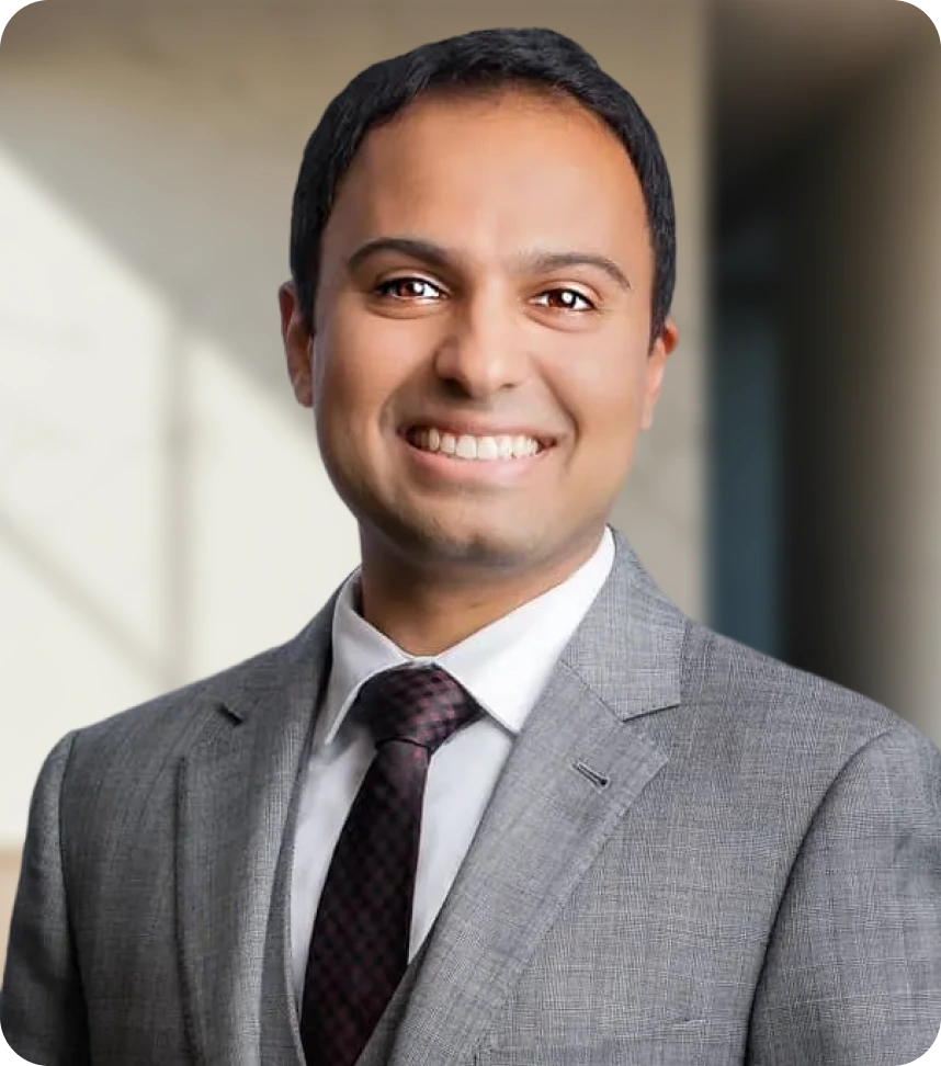 Dr. Viraj J. Mehta, MD, MBA professional headshot in gray suit and purple tie