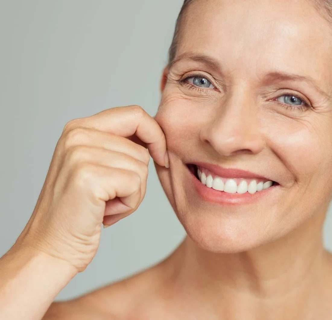Smiling mature woman enjoying natural-looking facelift results