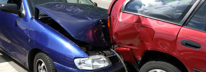 Blue and red cars with front-end collision damage