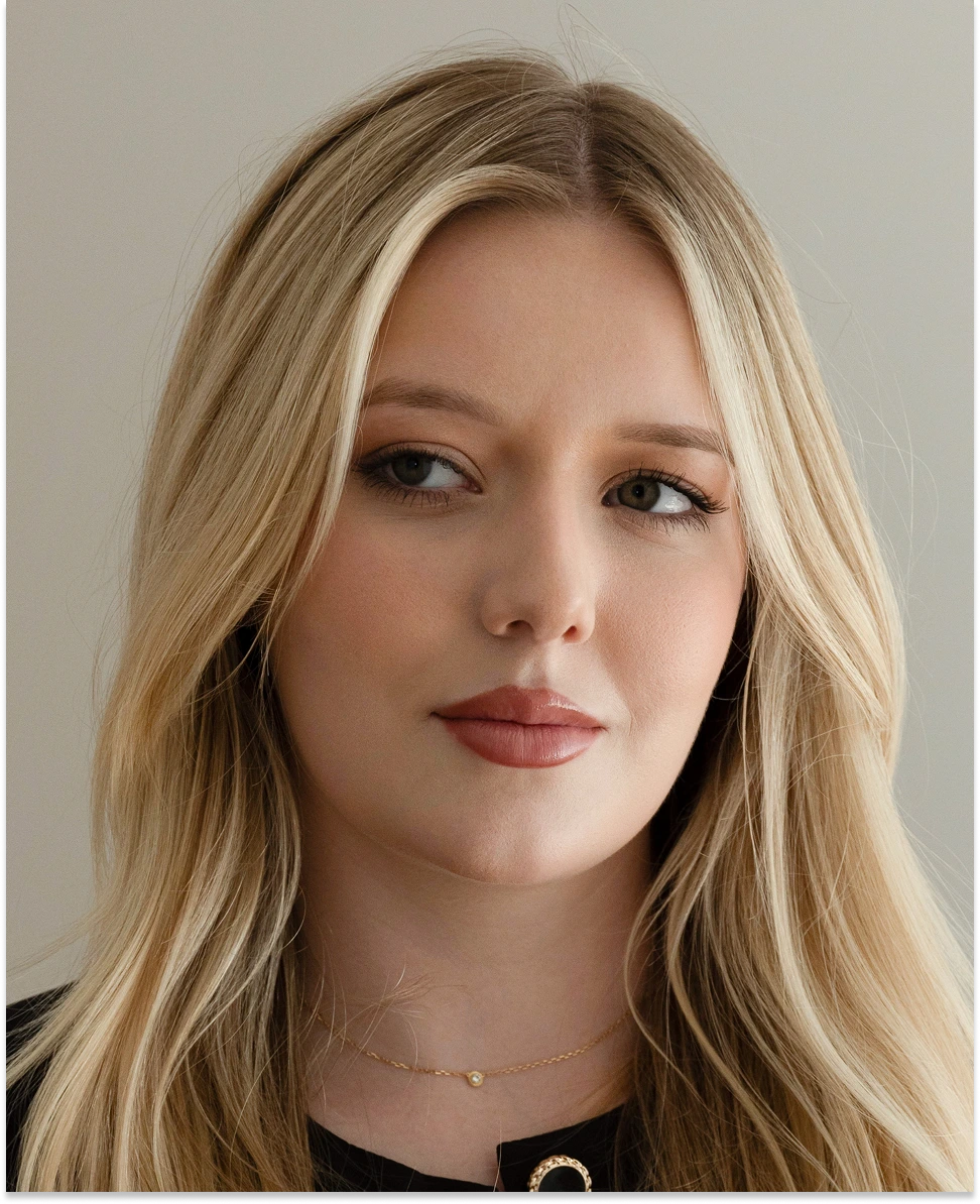Woman with blonde hair looking to the side, demonstrating neurotoxin treatment areas