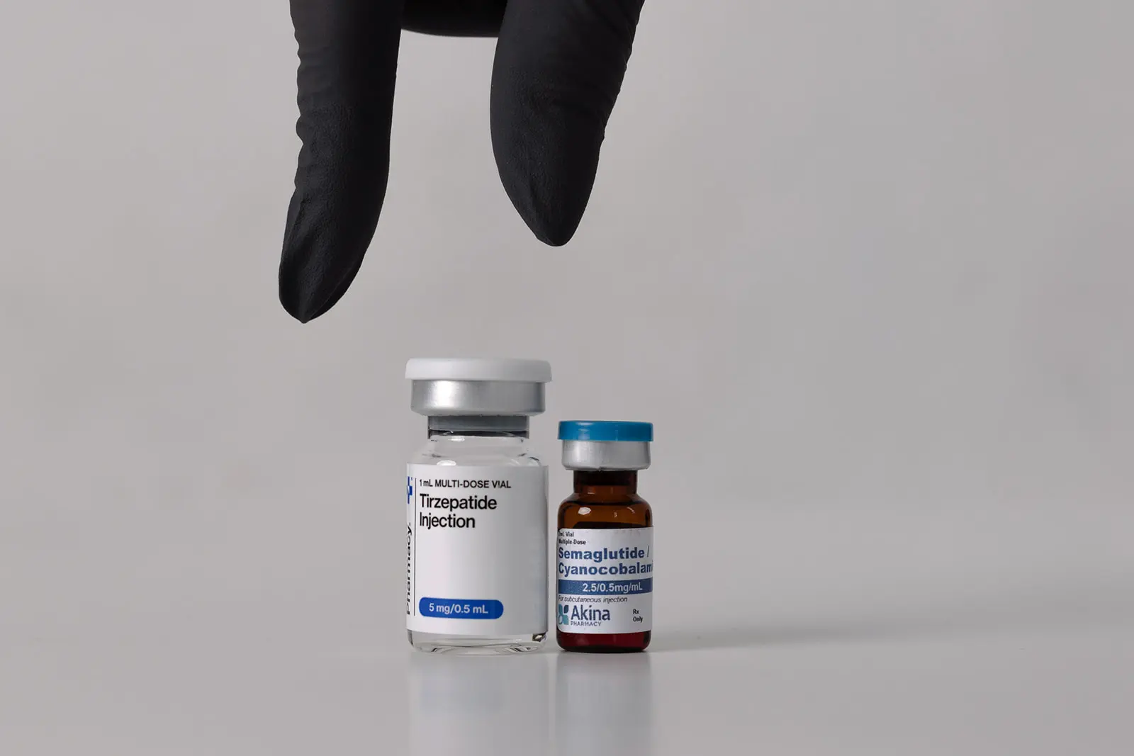 Tirzepatide Injection and Semaglutide vials displayed with legs jumping above