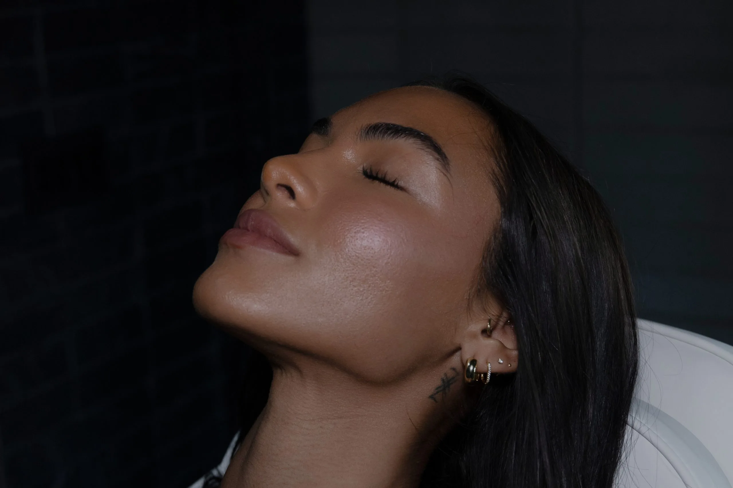 Woman's profile showcasing enhanced facial contours and smooth skin tone