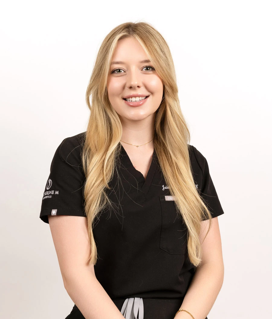 Jaida Hagen, Profile Aesthetics staff member, wearing black branded scrubs