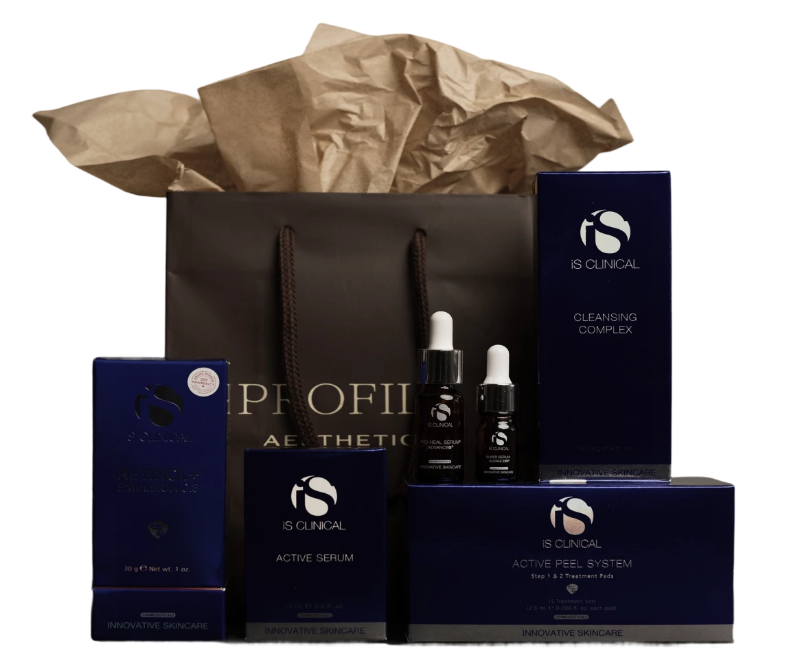 iS Clinical skincare product collection in black shopping bag with serums, cleansing complex, and active peel system boxes