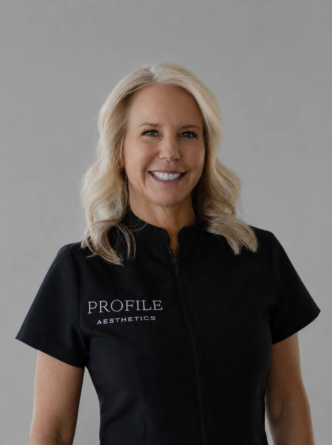 Courtney Francis, Profile Aesthetics team member, wearing black Profile Aesthetics jacket