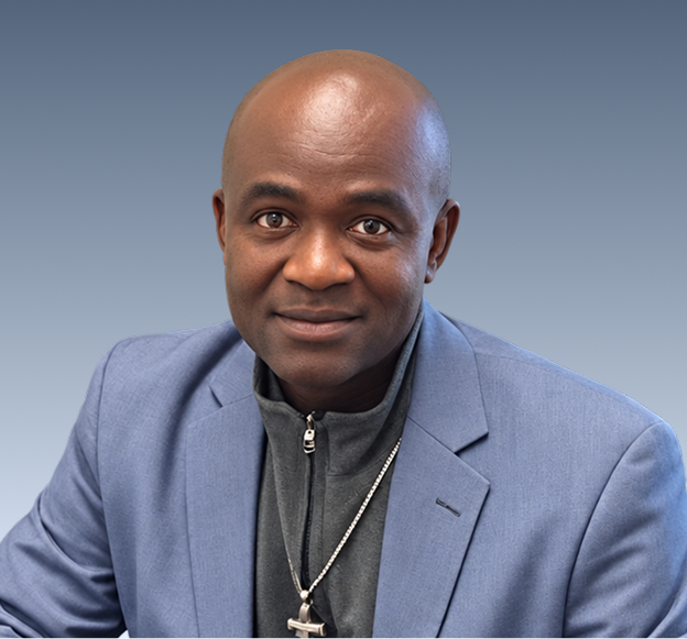 DR. UCHENNA ORJI, a team member at Progressive Movement Inc., smiling at the camera