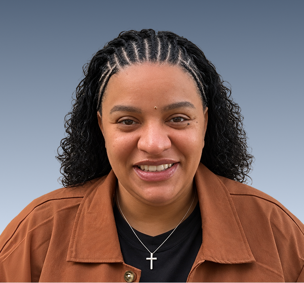 Team member headshot against blue background, smiling at camera