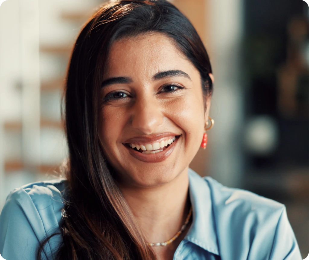Smiling therapist in blue shirt during an individual therapy session