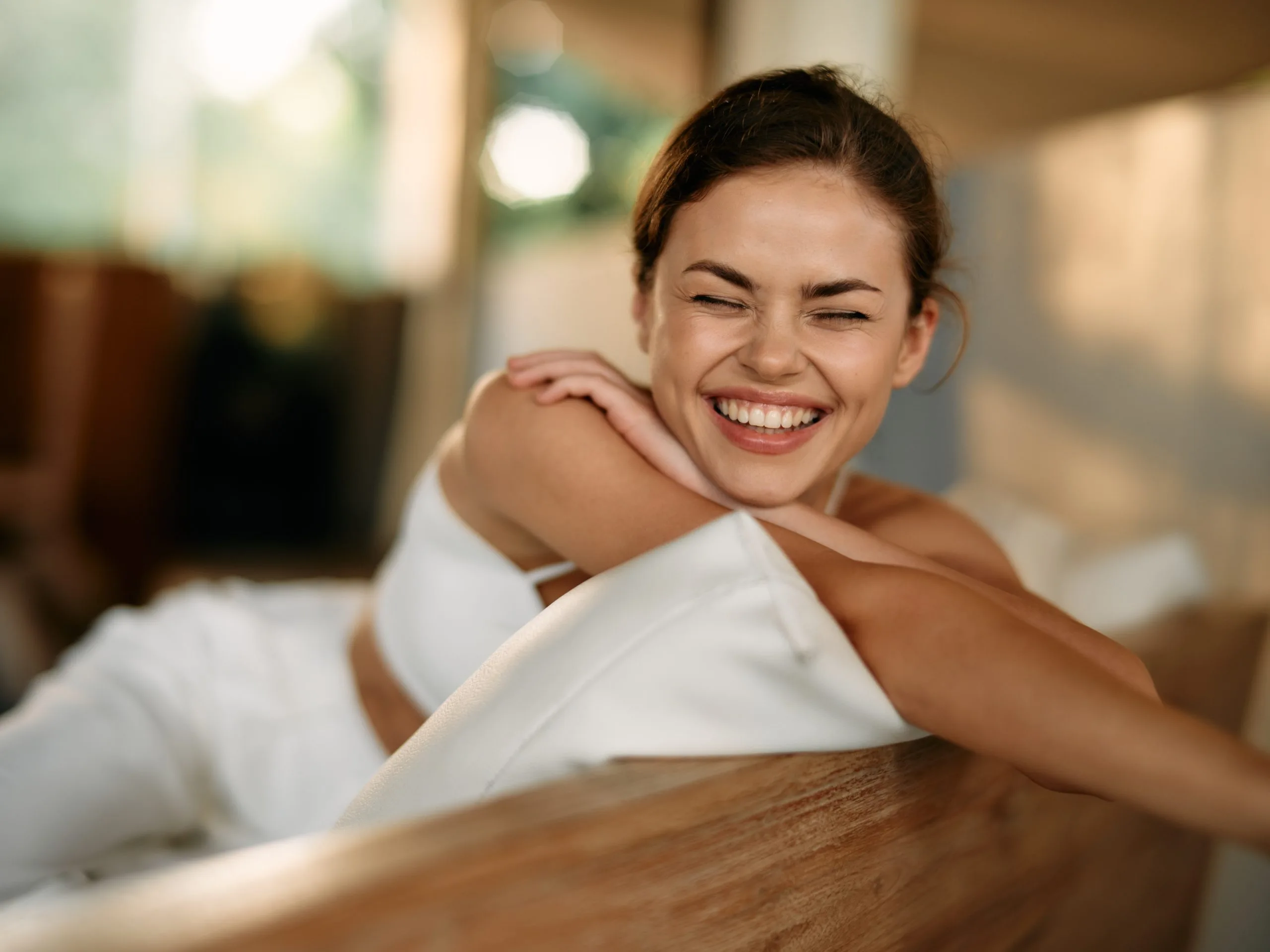 Smiling woman relaxing at home, representing psychiatric care in Corona, CA