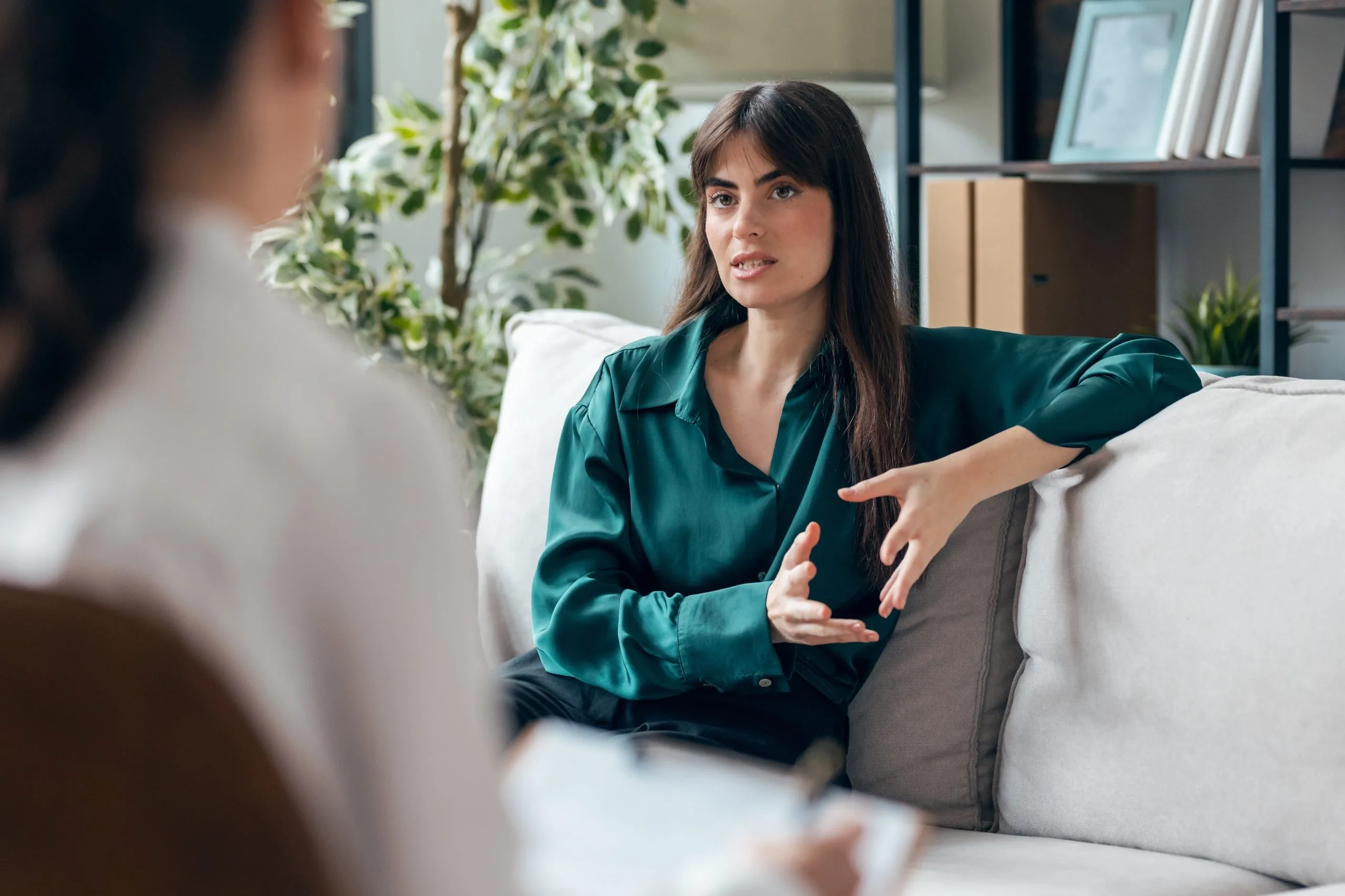Woman talking with a therapist during a session in Adelanto, CA