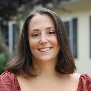 Lily Granai, therapist at The Psyched Group, smiling outdoors