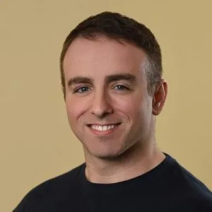 Michael Tiberio, LMHC, smiling at the camera against a neutral background