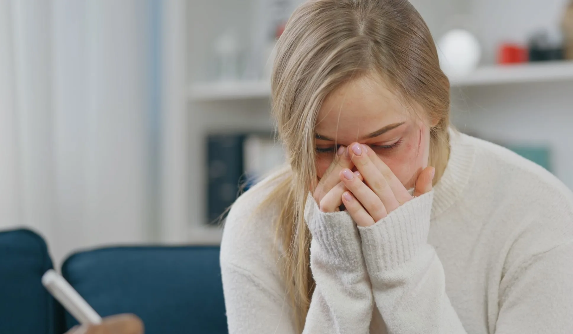 Upset woman covering her face