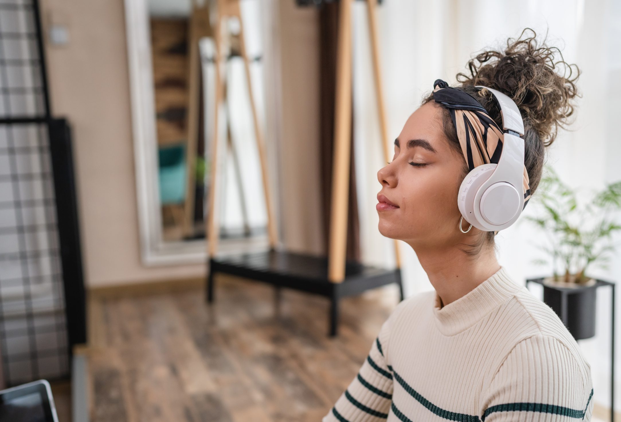 Woman meditating with headphones on
