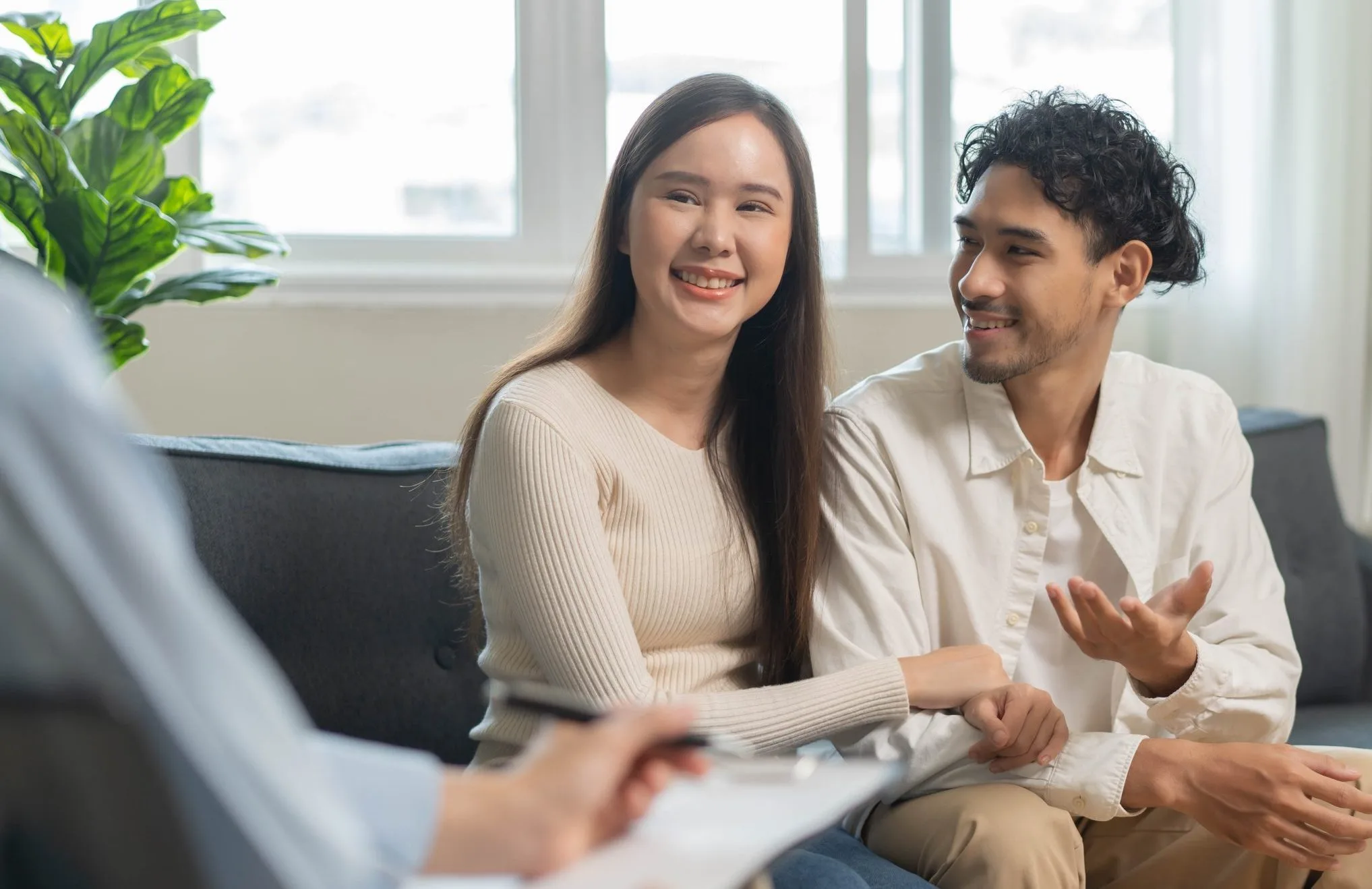 Smiling couple in a counseling session