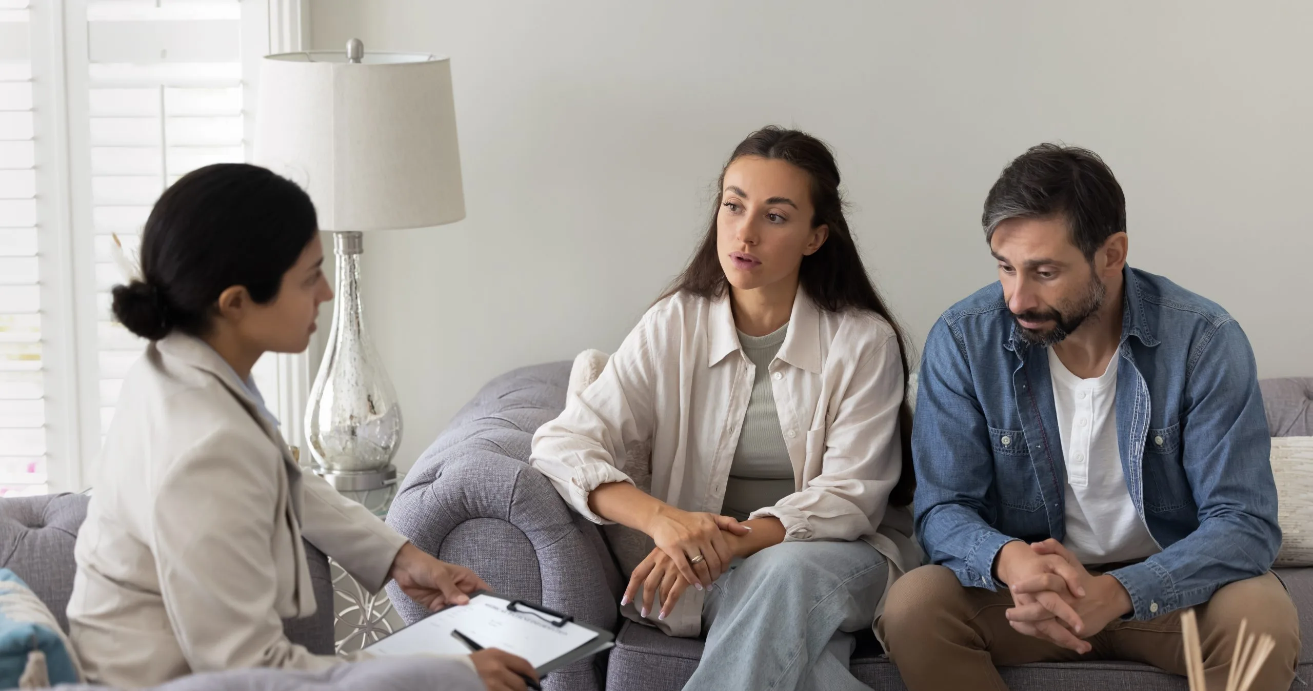 Couple talking with a therapist