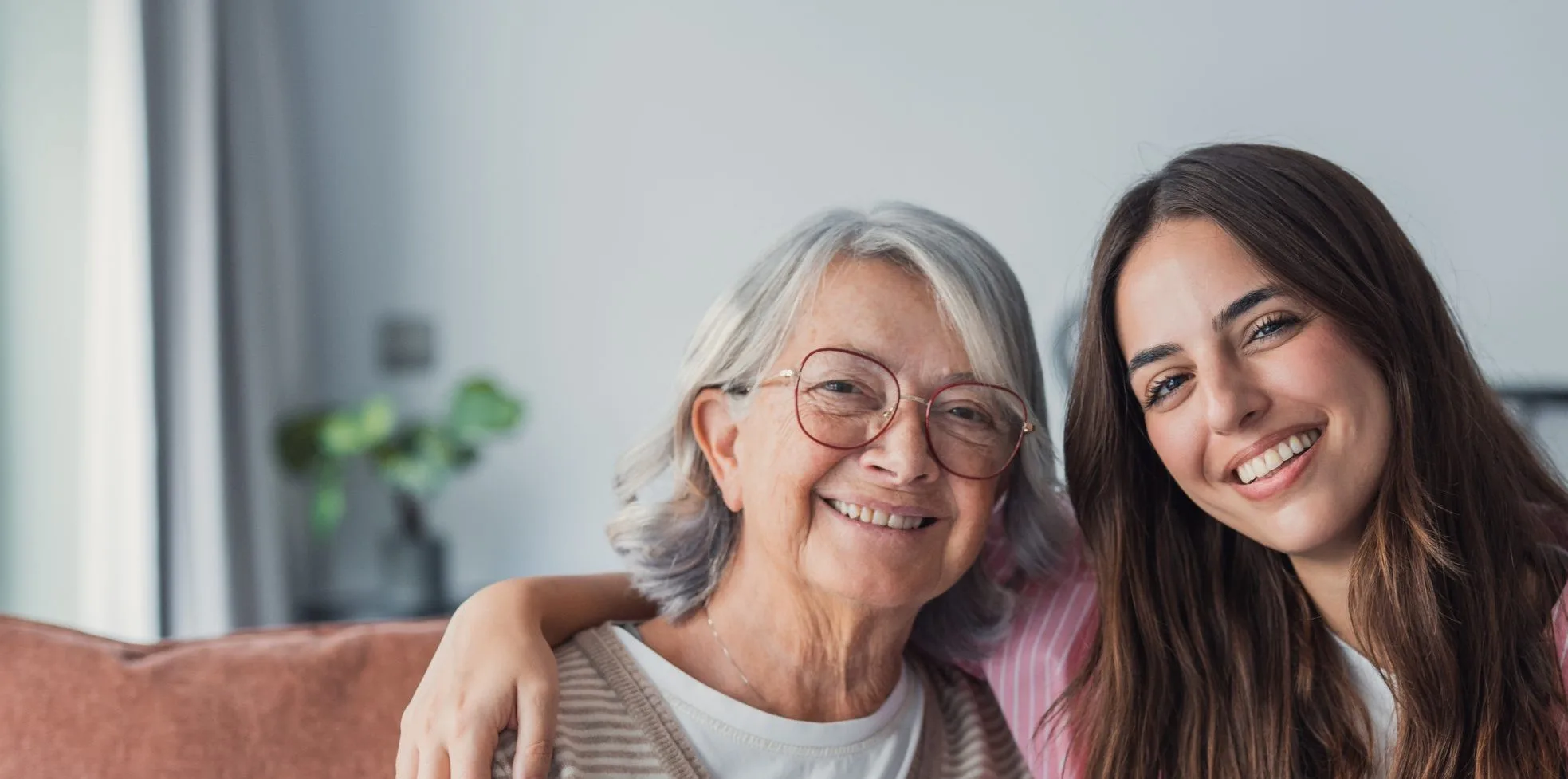 Smiling grandmother and adult daughter
