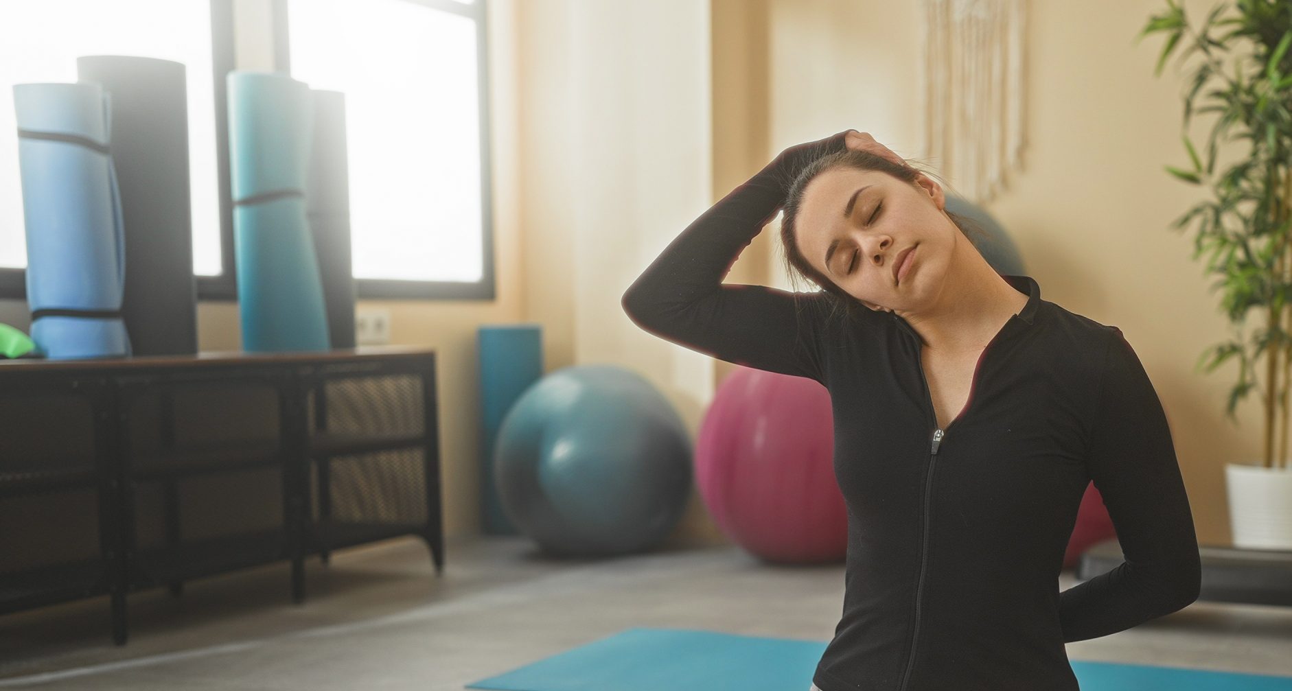 Woman stretching in a yoga studio