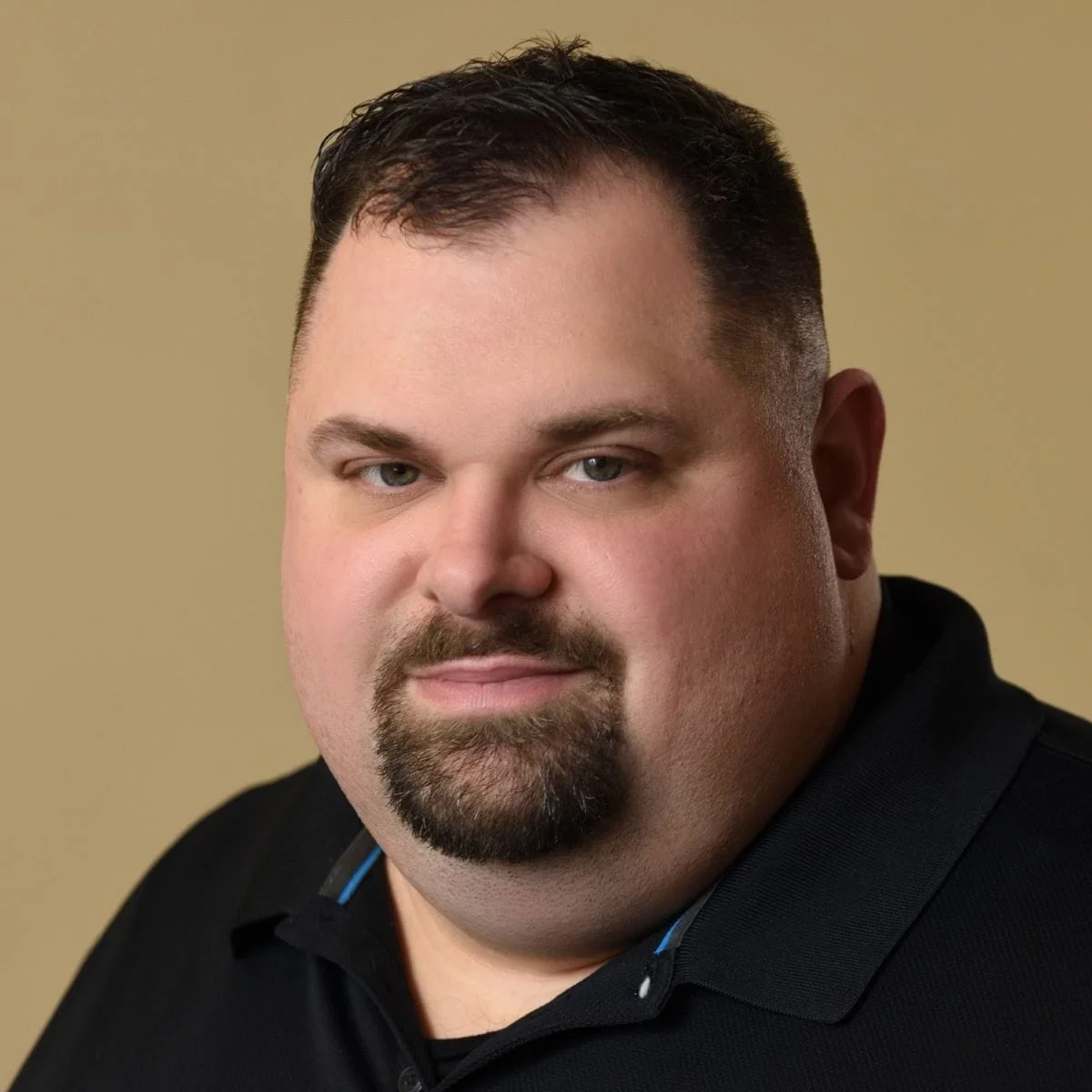 Todd Derbyshire, LMHC, therapist headshot against a neutral background