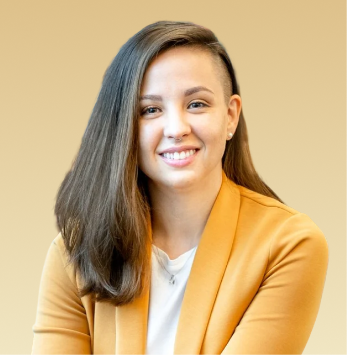 Carissa Cullum Ferdinand, MA, NCC, LPC, smiling at camera wearing yellow blazer