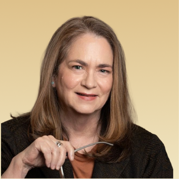 Margaret L. Bluhm, PhD, LMSW, professional headshot against tan background